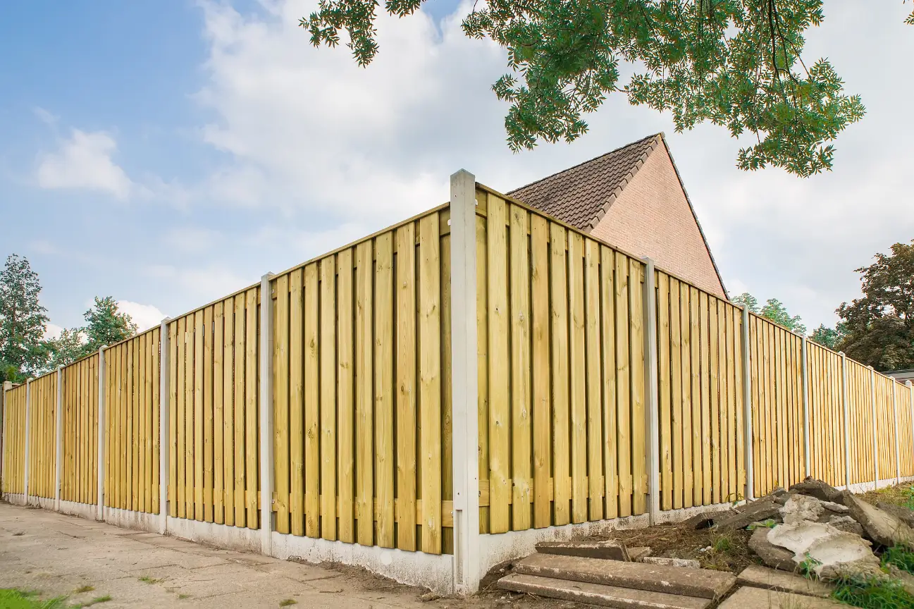 Builders Rodney fencing contractors showcasing a tall timber fence with concrete posts surrounding a residential property.