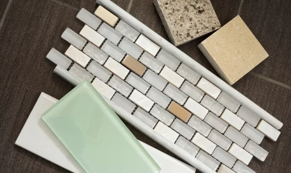 Assorted tiles and surface samples prepared by Builders Rodney showcasing bathroom renovations design options