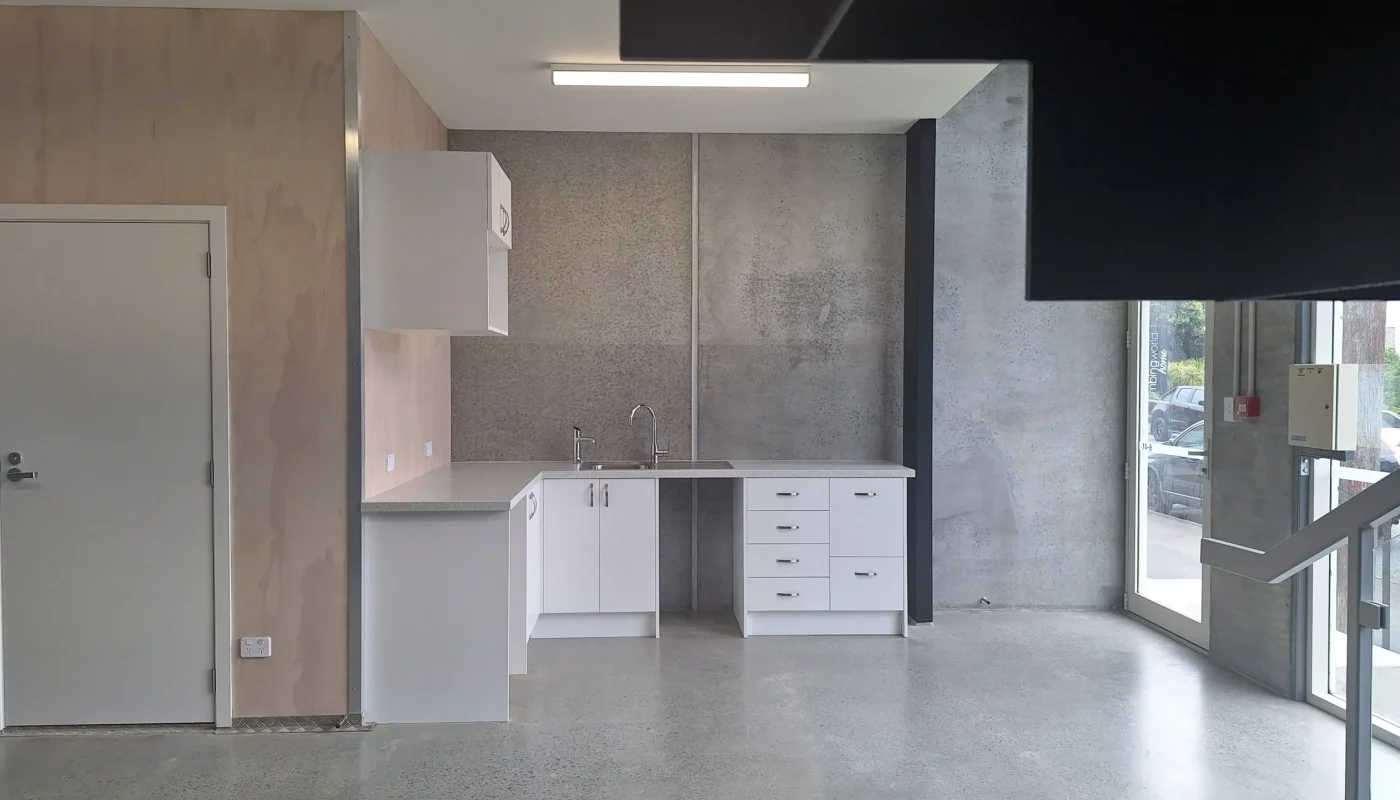 Sleek kitchen renovations completed by Builders Rodney with a modern industrial look.